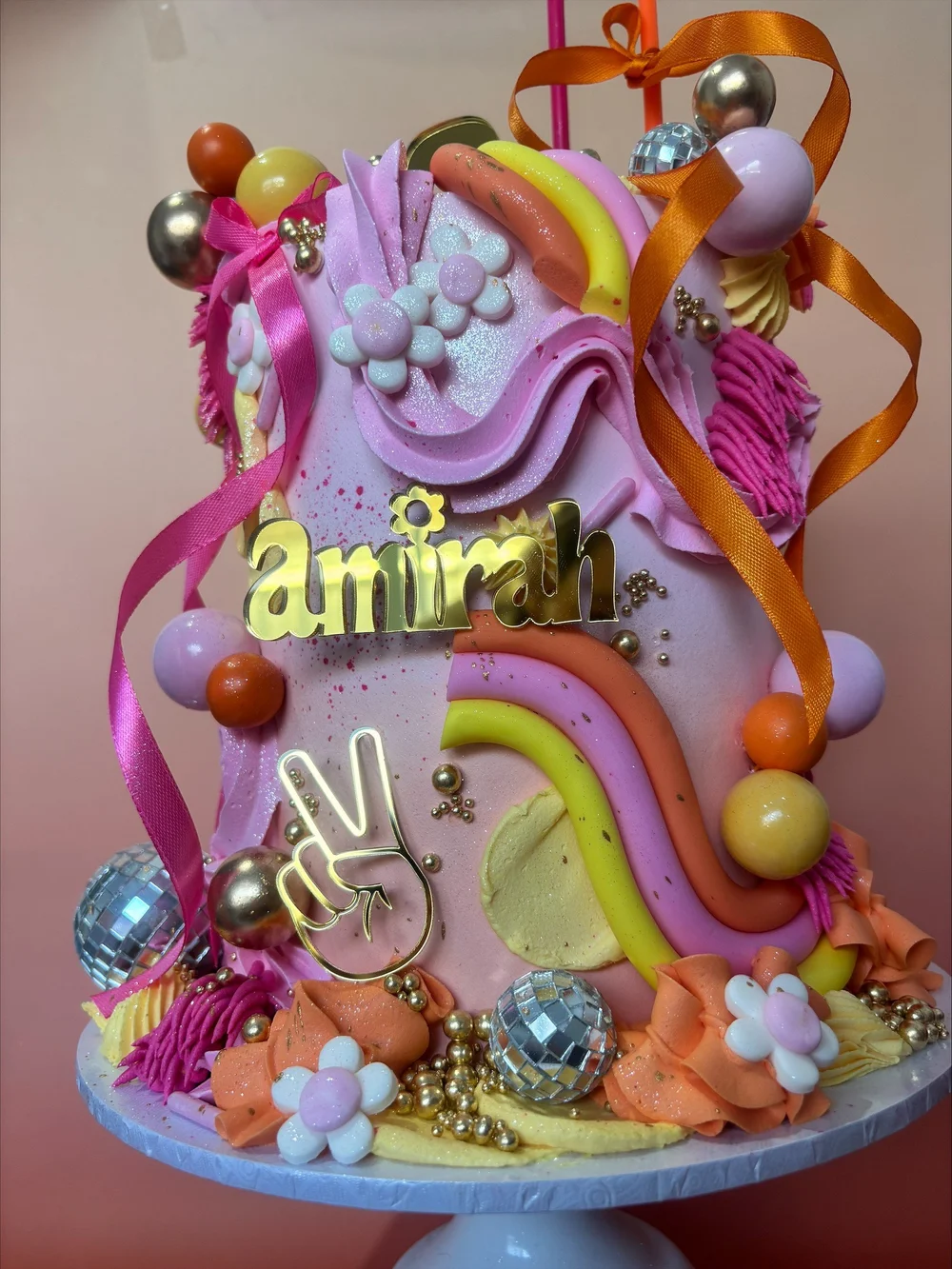 Retro rainbow birthday cake with gold lettering